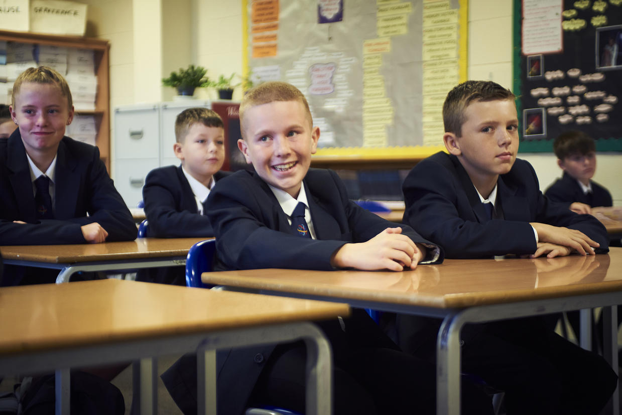 Schoolboy sits with classmates at The Macclesfield Academy