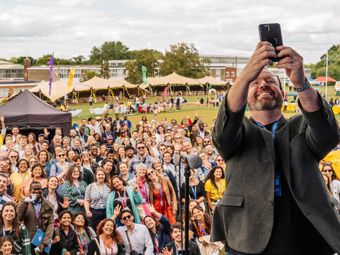 Teach First CEO Russell Hobby takes a selfie with a crowd of spectators