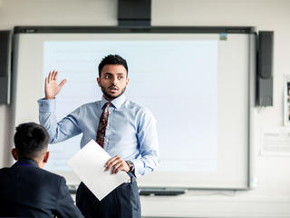 Male teacher teaching a class