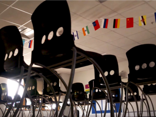 Chairs on tables in an empty classroom
