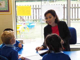 Headteacher talking to pupils