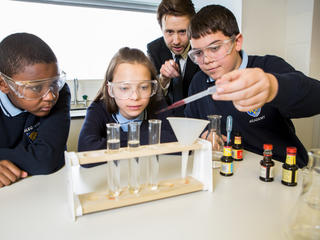 Pupils looking at test tubes