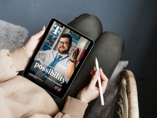 Woman looking at TF interactive brochure on iPad