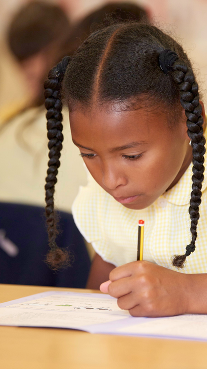 Girl in school doing work