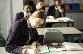 Secondary school students studying in a classroom